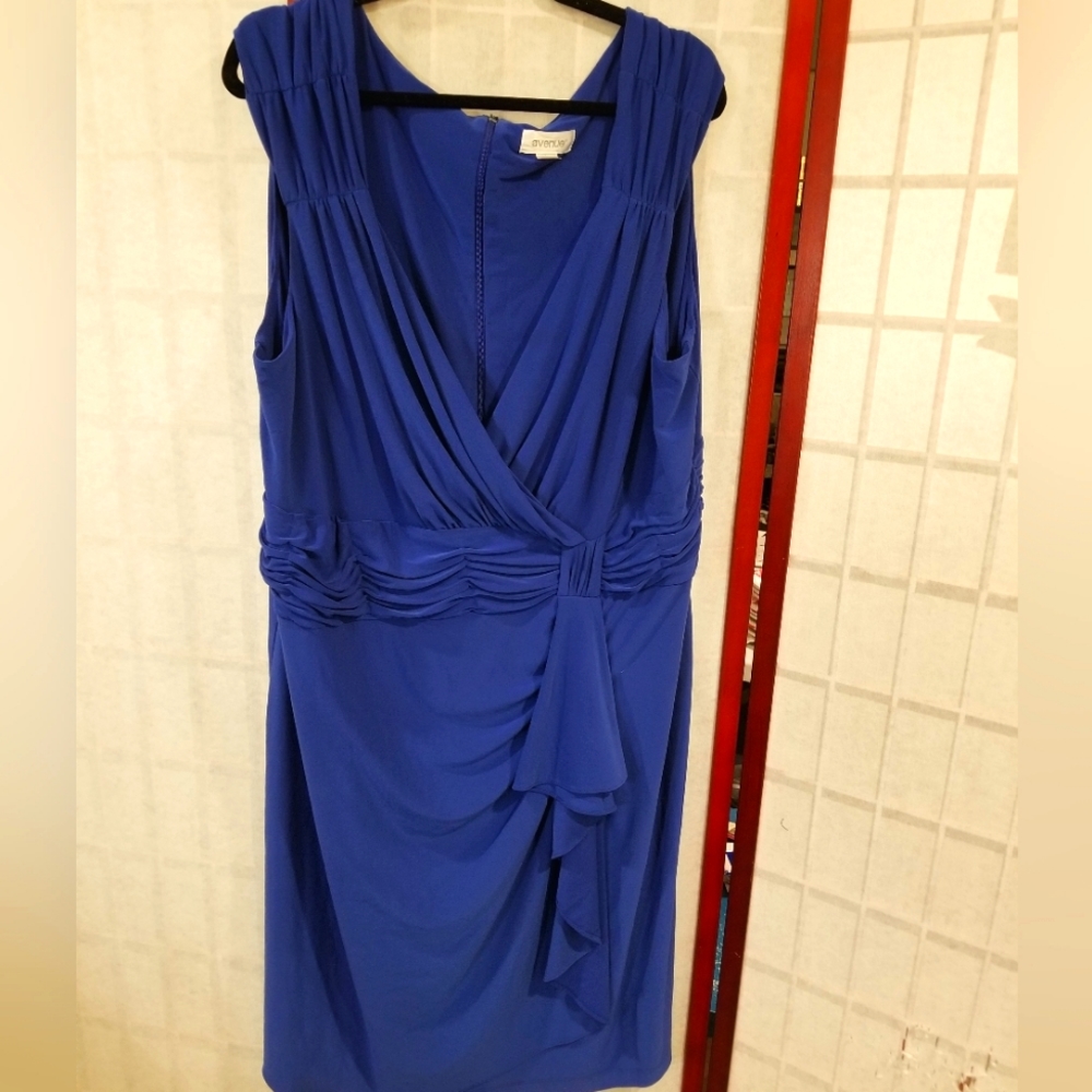 Blue party dress. Crossover top with ruched belt detail and faux tie. Size 24
